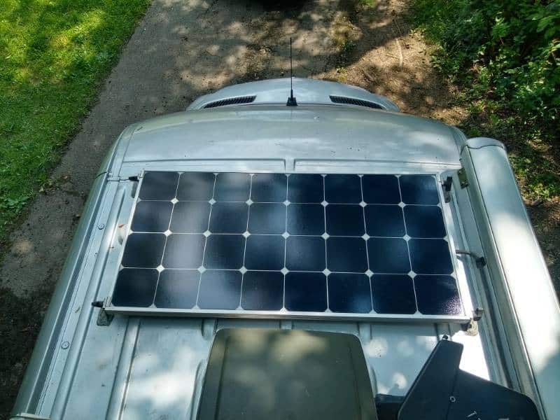 RV rigid solar panel mounted on the roof of a Class B van
