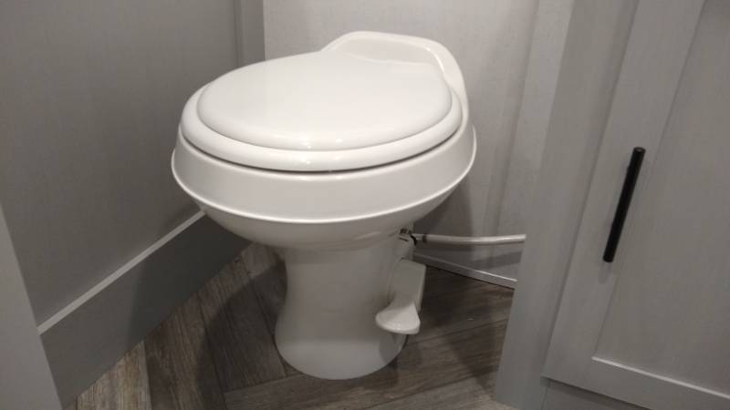 Conventional RV gravity toilet with foot flush pedal