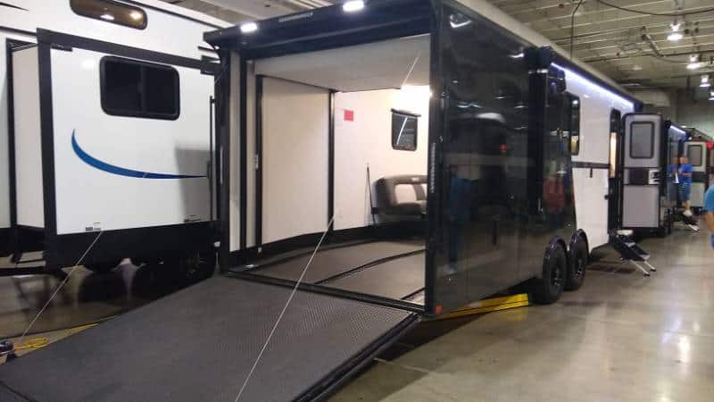 Toy hauler RV with the rear garage door open