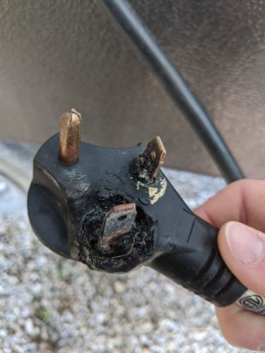 A burned electrical plug