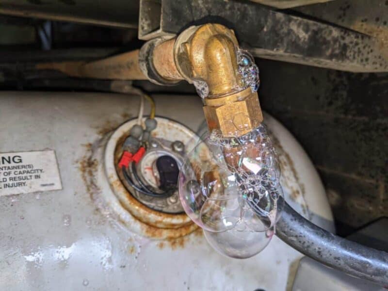 Propane gas line leak, shown with soapy water bubbles