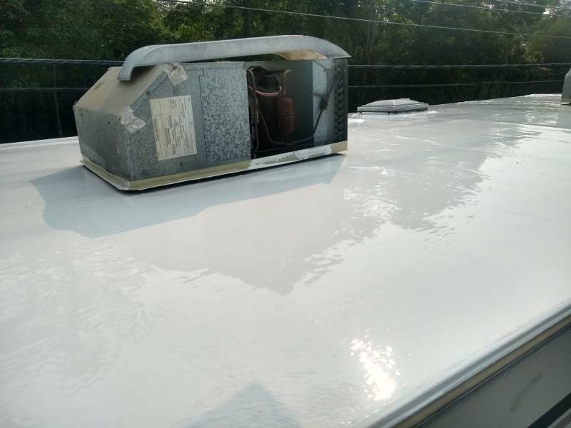 white RV Henry's roof resealing