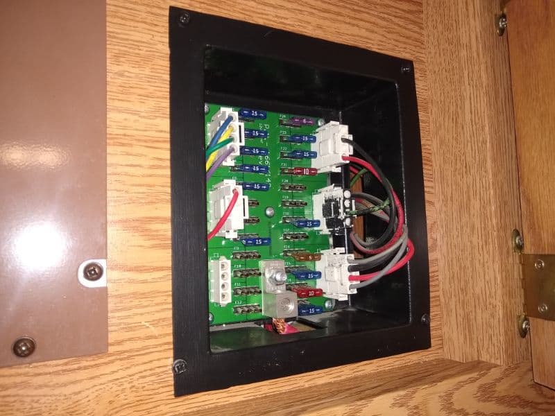 RV DC fuse panel in cabinet