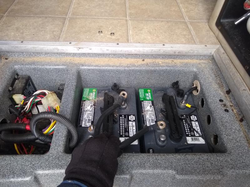 dual golf cart batteries in motorhome compartment