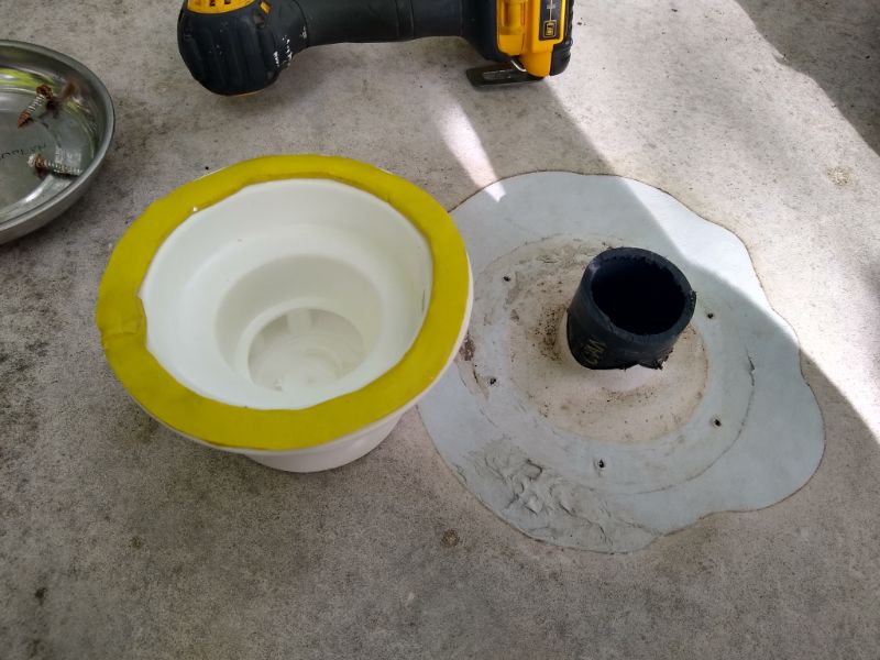 Yellow butyl rubber tape on plumbing stack vent cap