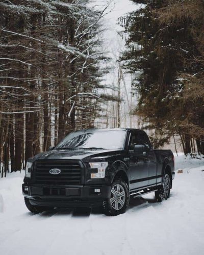 Black Pickup Truck in Snow